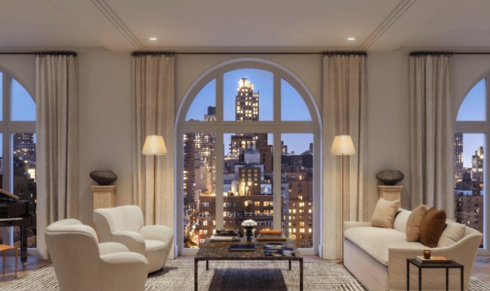 Living room framed by arched windows onto the Manhattan skyline